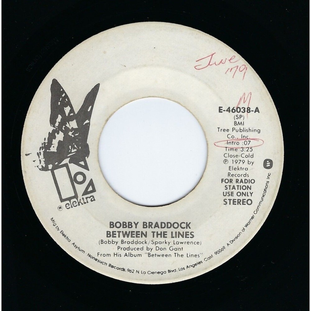 Bobby Braddock Promo Vinyl 45 Between The Lines/The Happy Hour on Elektra VG+